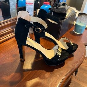 Black high heels with gold accents